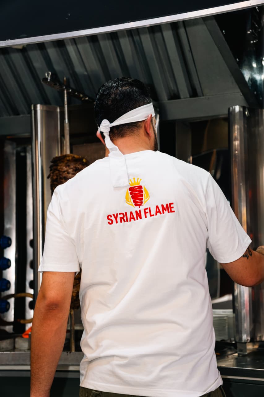 Sizzling shawarma on the spit at Syrian Flame